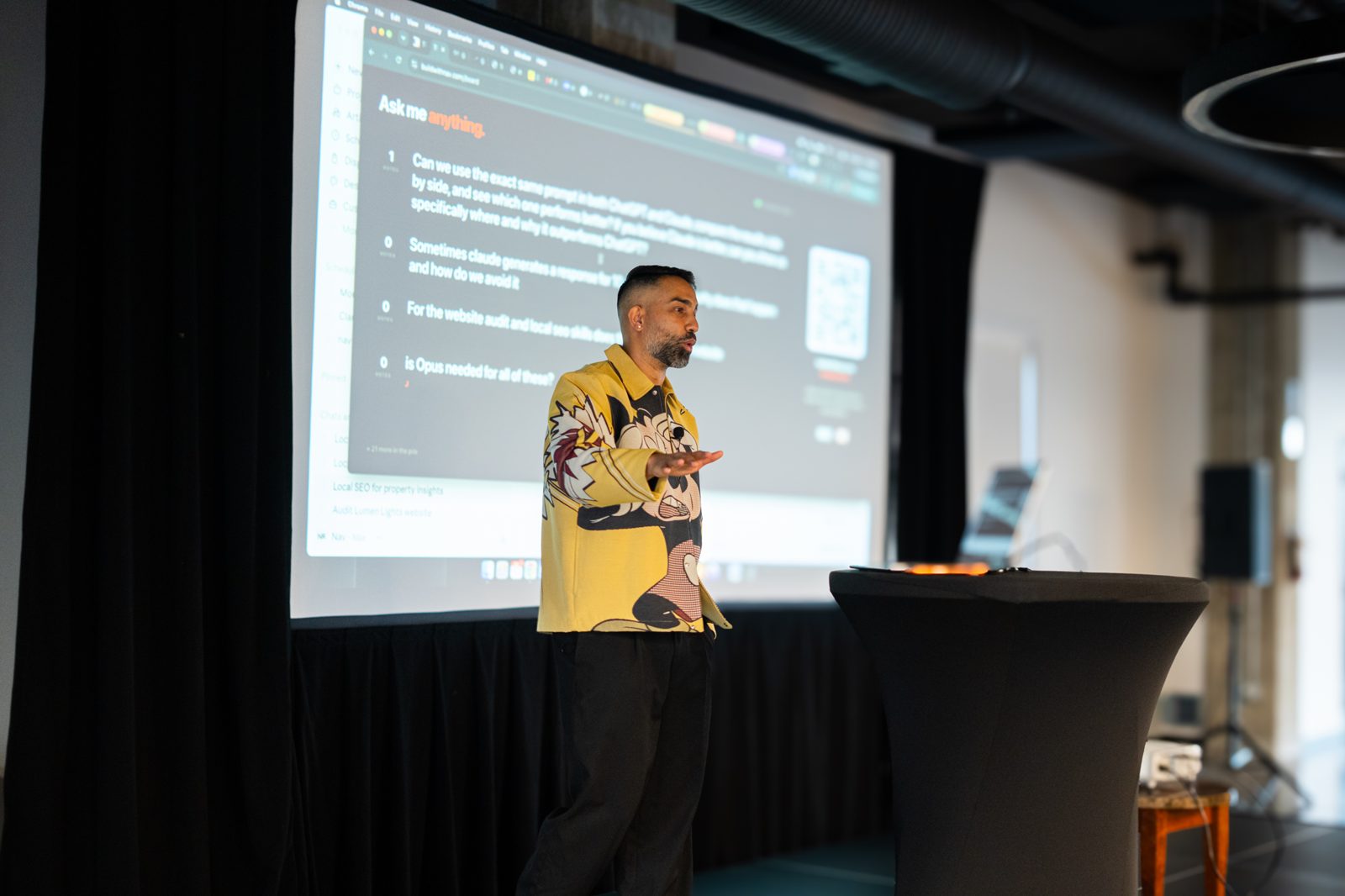 Nav building live on the projector, QR code on screen for the room to scan